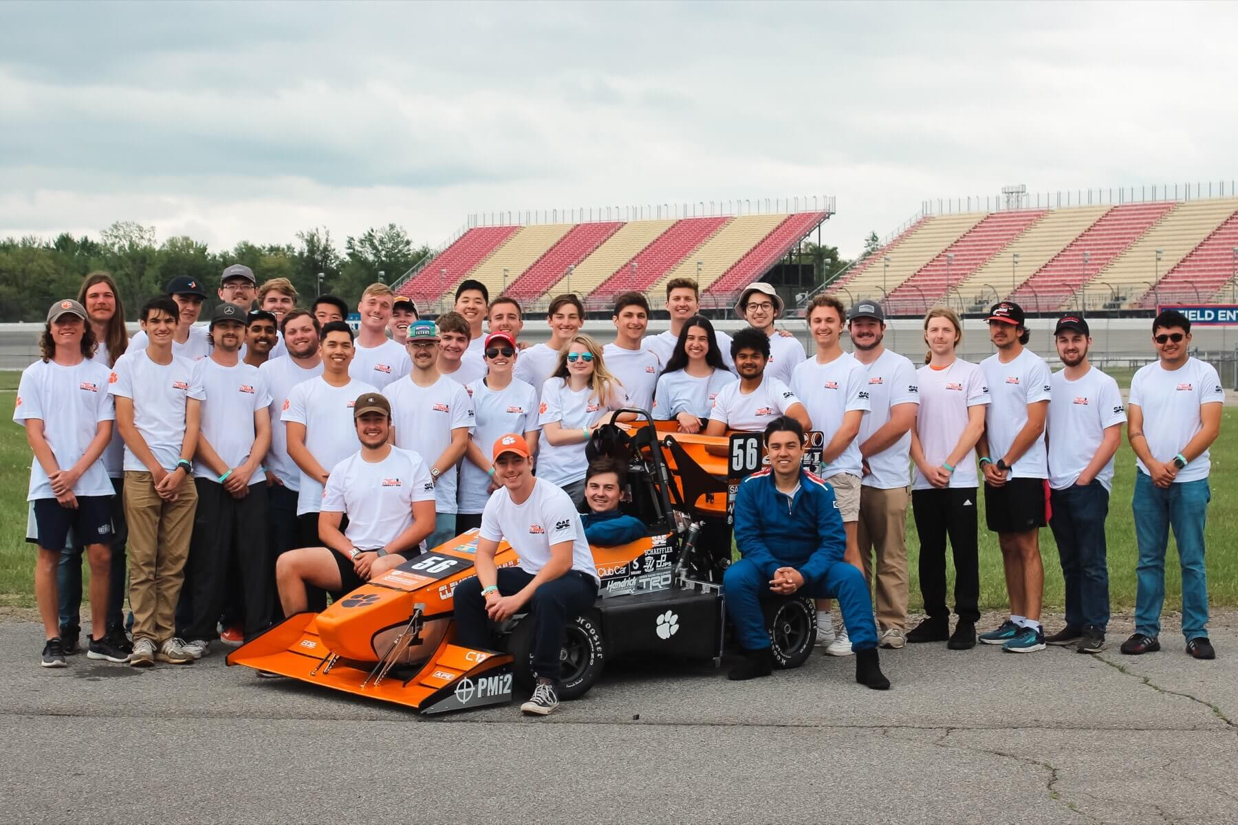 Clemson Formula SAE team posing with the race car