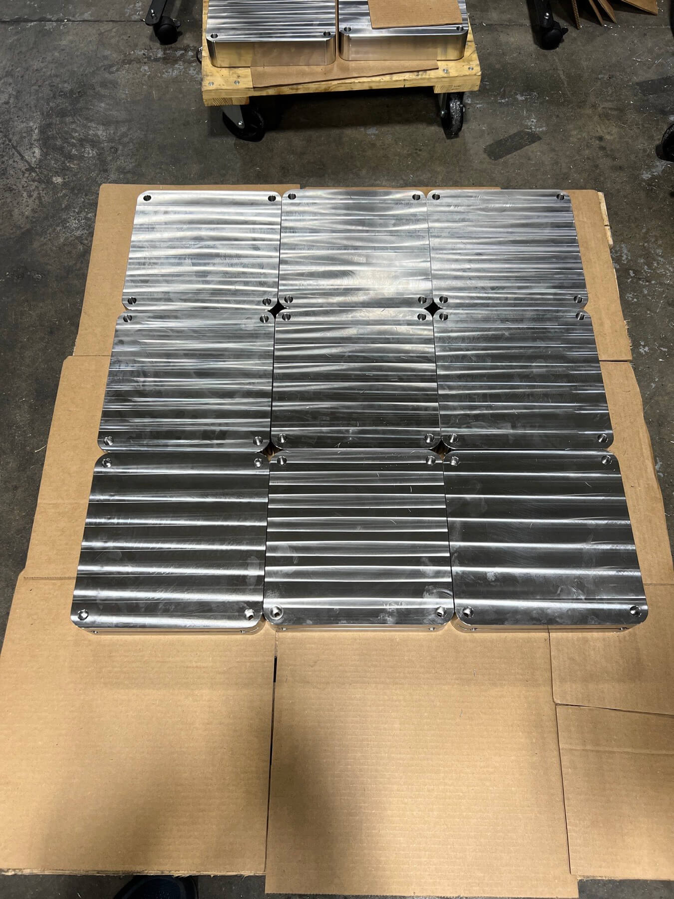 Nine build plates lying together
